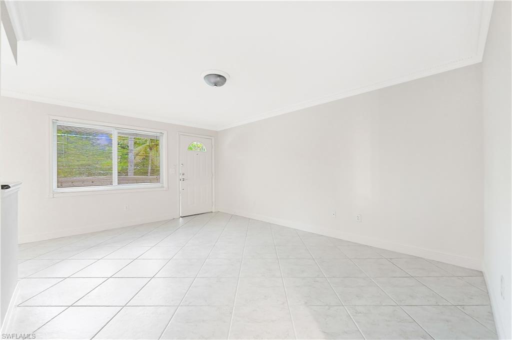 950 7th Avenue South, Unit 26 Naples, FL 34102 - Photo 4 of 15 an empty room with windows