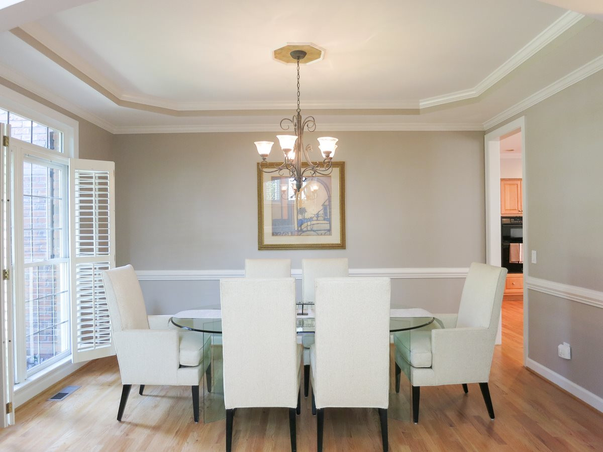 12508 Canolder Street Raleigh, NC 27614 - Photo 3 of 25 The spacious formal Dining Rm offers a tray ceiling, lg arched doorway, chair rail & wrought iron chandelier. Updates in this home include NEW HVAC 2015 & 2010, NEW Water Heater 2011 and fresh paint inside and out. Dining Room