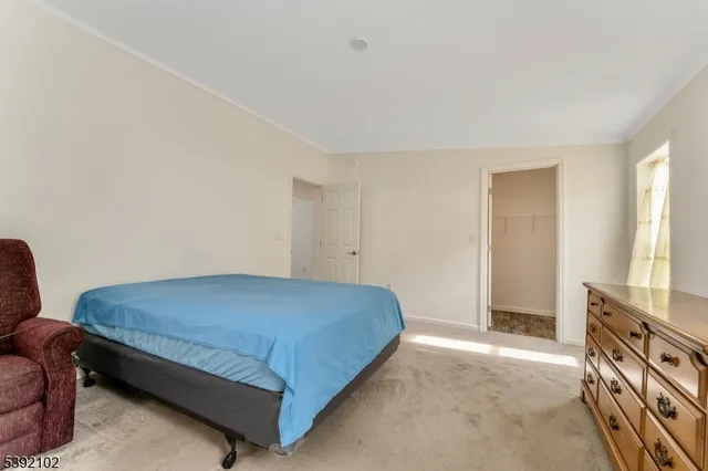 a bedroom with a bed and furniture