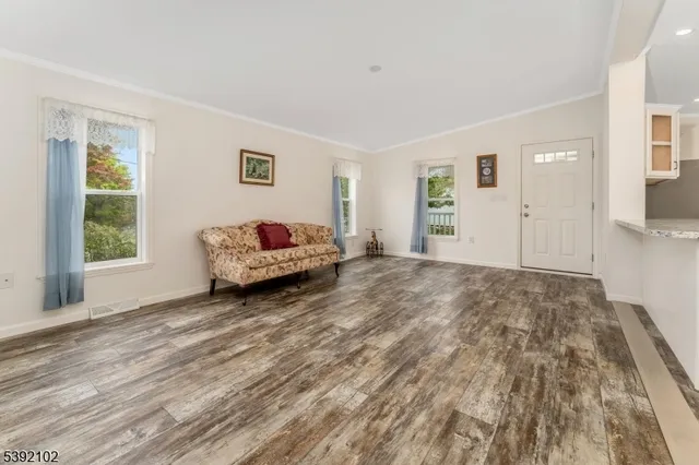 a spacious bedroom with a bed and a window