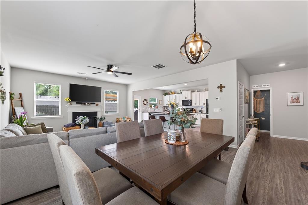 266 Shoals Bridge Road Acworth, GA 30102 - Photo 11 of 43 a view of a dining room with furniture window and wooden floor