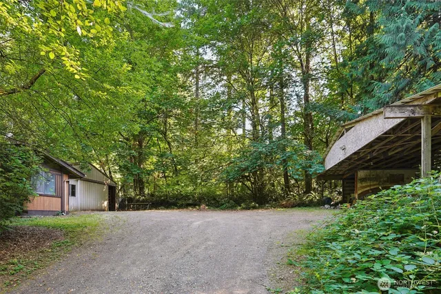 a view of a house with a tree