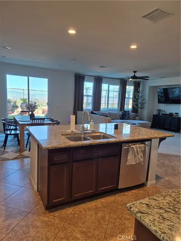a living room with granite countertop furniture and fireplace