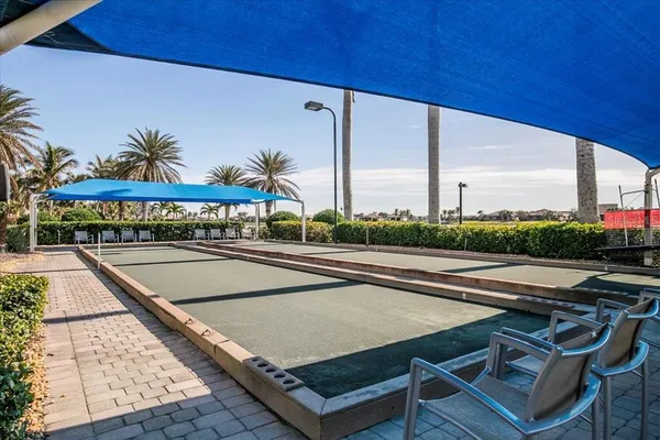 a view of swimming pool with chairs
