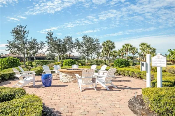 a view of a patio with a dining table and chairs