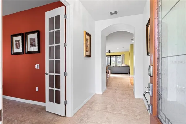 a view of livingroom with hallway and wooden floor