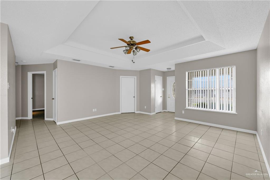 1702 Aries Street Mission, TX 78572 - Photo 2 of 19 a view of an empty room with a window