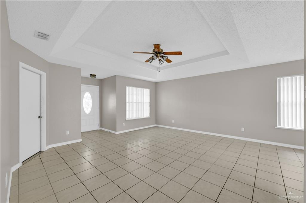 1702 Aries Street Mission, TX 78572 - Photo 3 of 19 a view of an empty room with a window