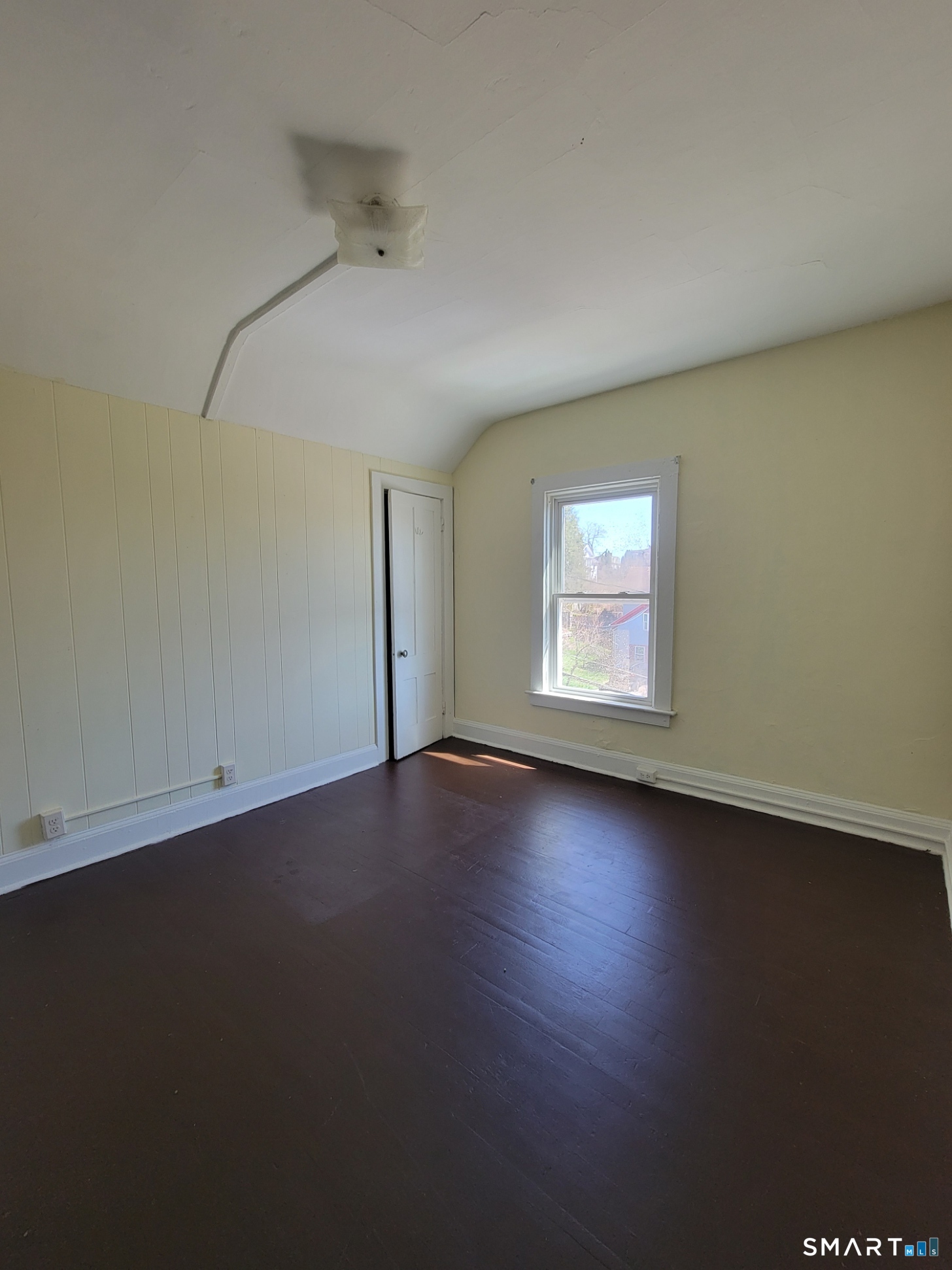 120 North Street, Unit 3 Windham, CT 06226 - Photo 11 of 11 an empty room with wooden floor and windows