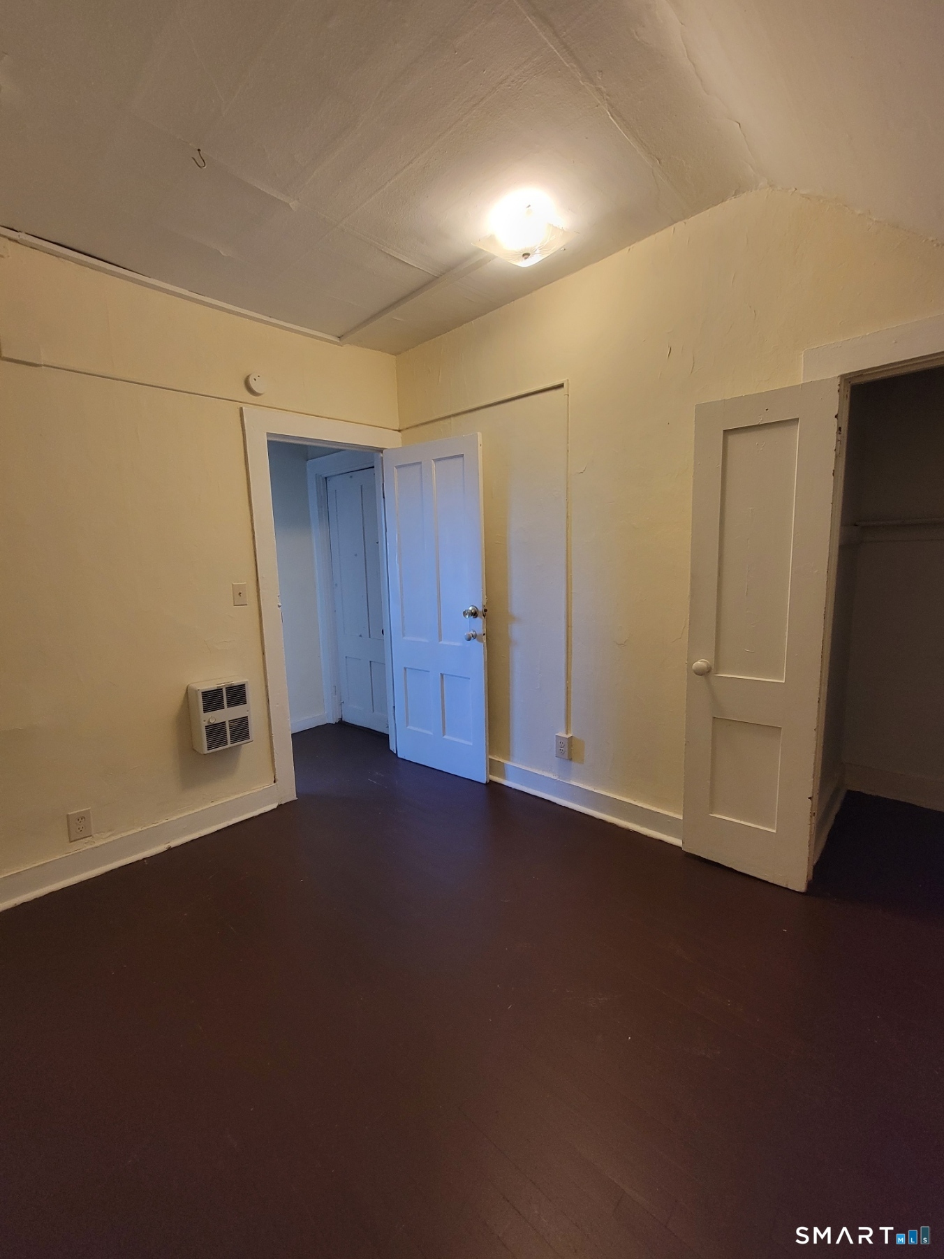 120 North Street, Unit 3 Windham, CT 06226 - Photo 3 of 11 an empty room with a door
