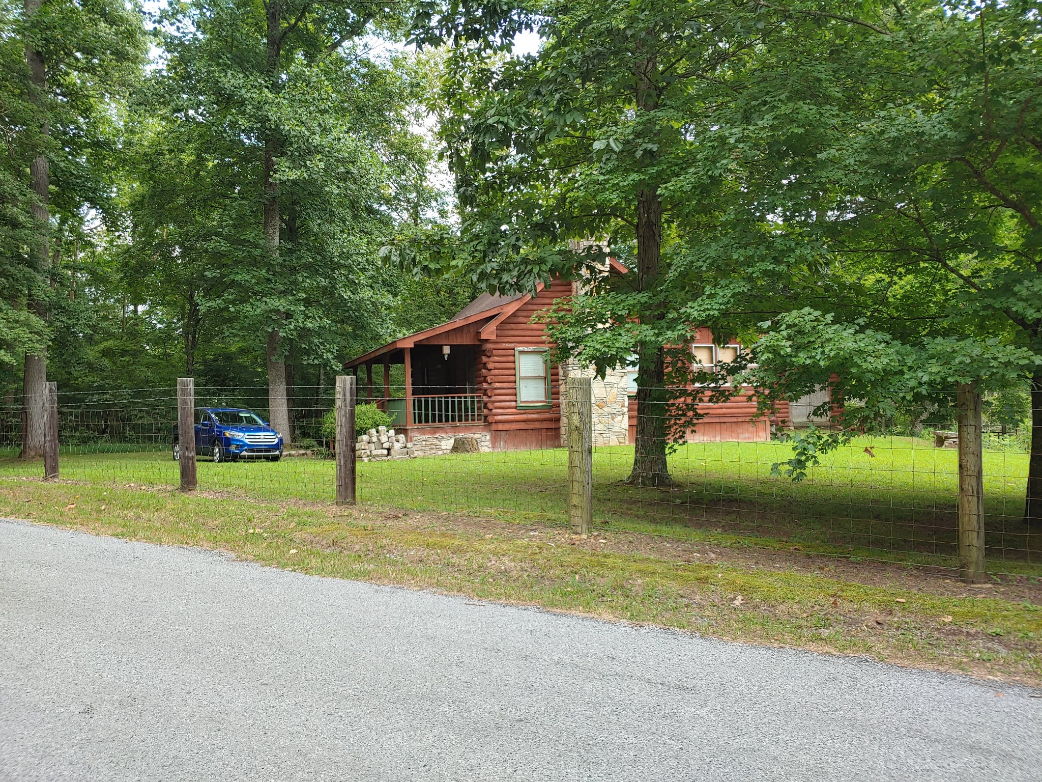 927 Lewis Branch Road Tennessee Ridge, TN 37178 - Photo 2 of 15 a view of a house with a backyard