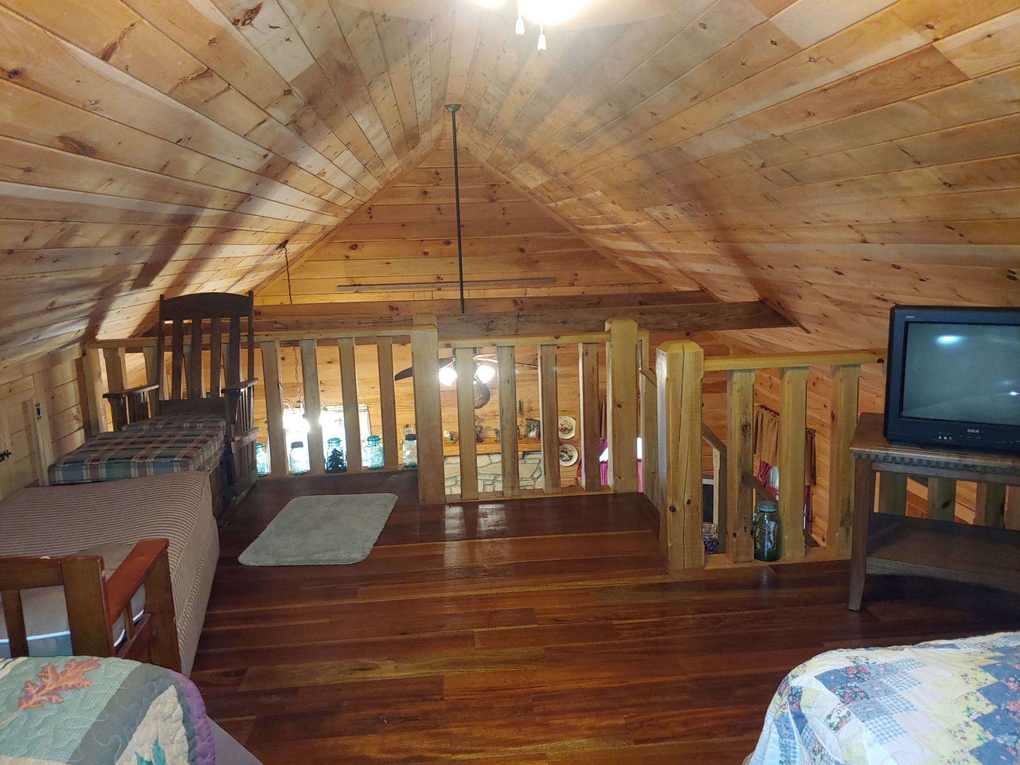 927 Lewis Branch Road Tennessee Ridge, TN 37178 - Photo 6 of 15 a view of a livingroom with furniture wooden floor and a chandelier