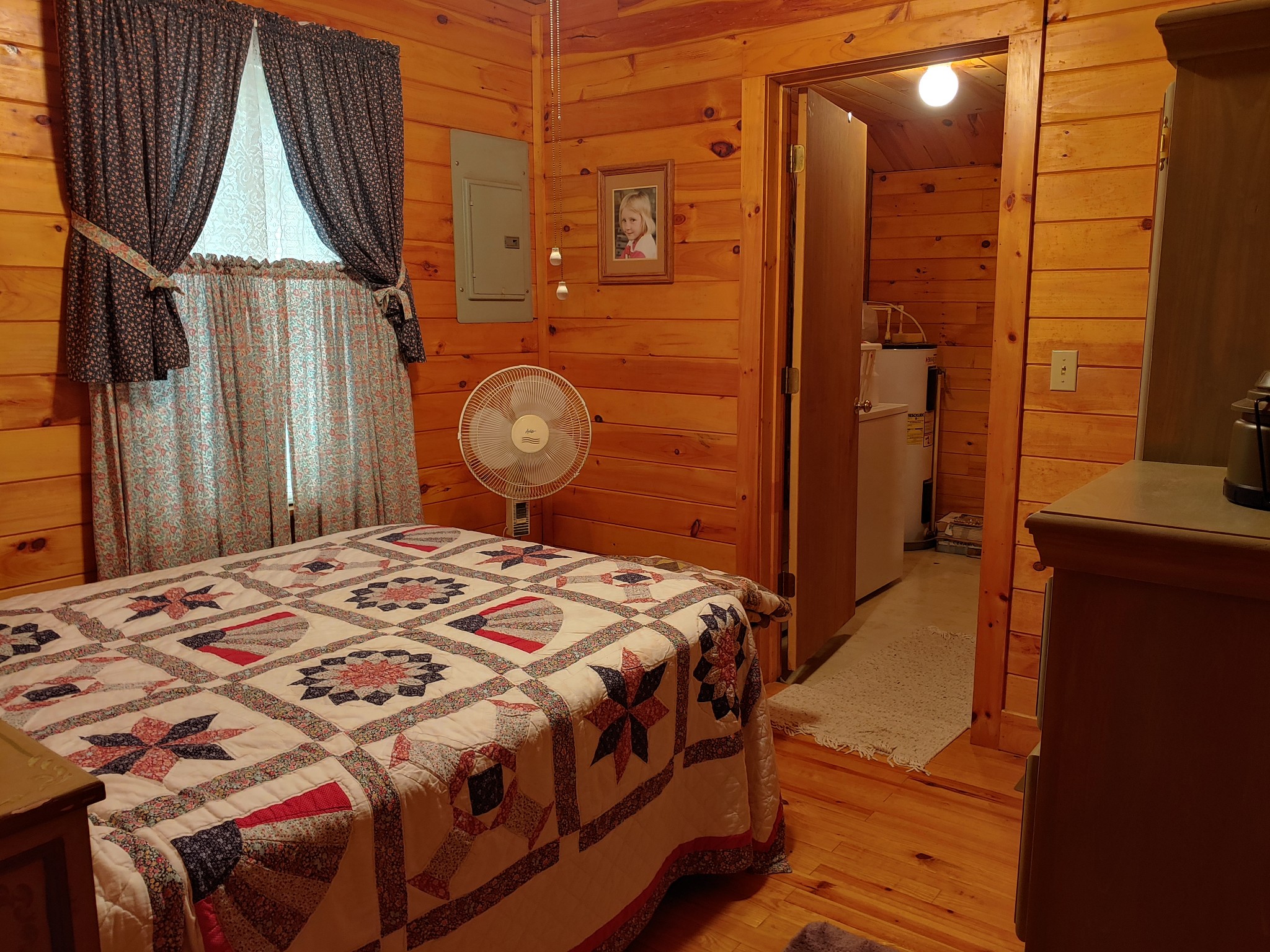 927 Lewis Branch Road Tennessee Ridge, TN 37178 - Photo 8 of 15 a bedroom with a bed a mirror and shower