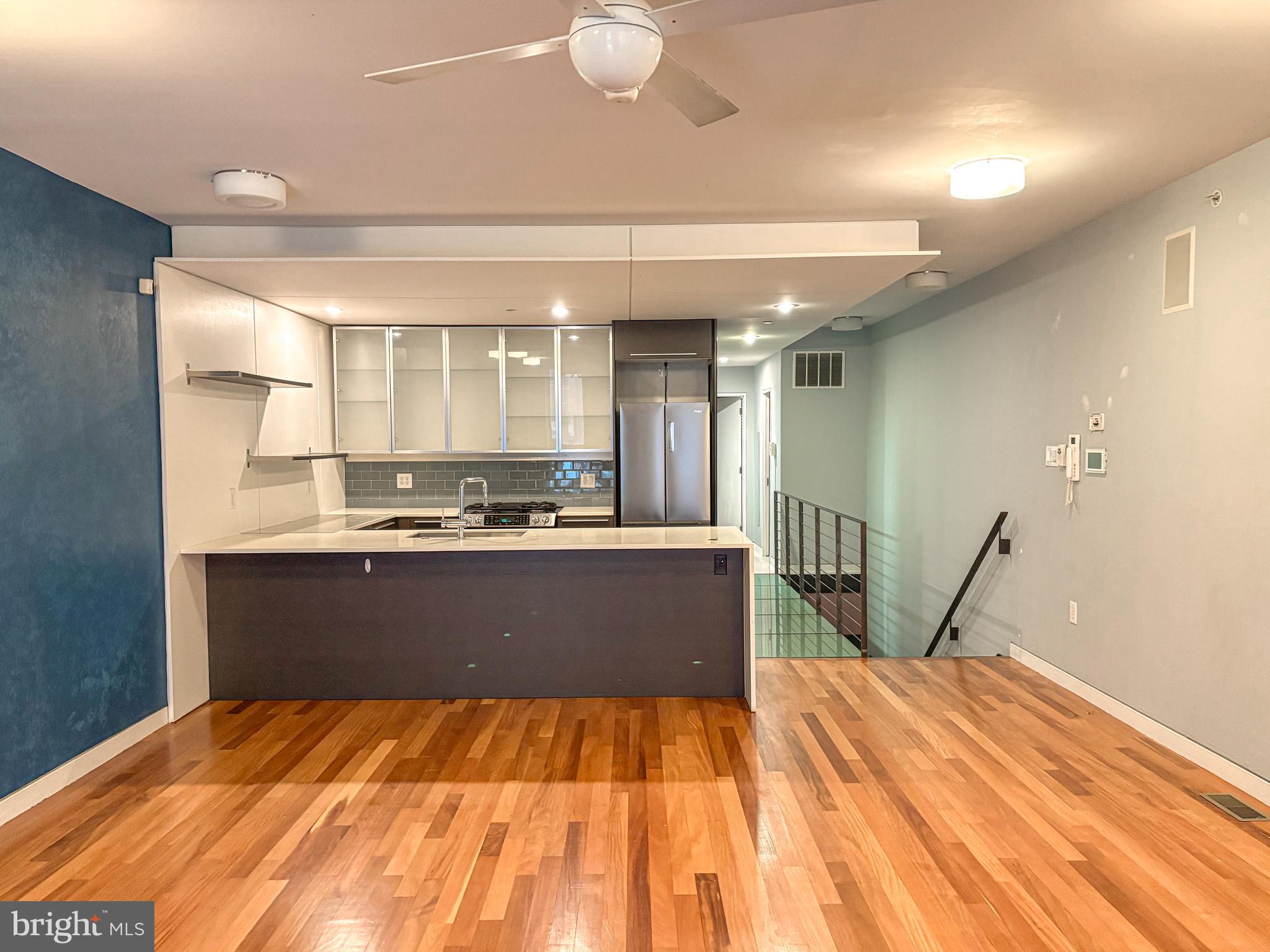 a view of kitchen with wooden floor