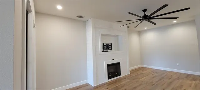 a view of a livingroom with a ceiling fan and a ceiling fan