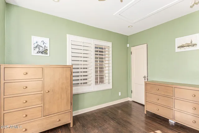 a bedroom with furniture and a window