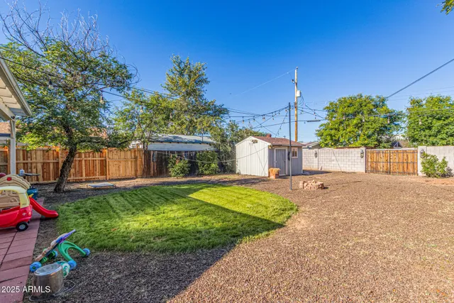 a view of a backyard with a sitting area