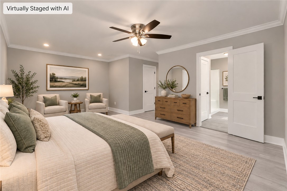 1747 A State Rd S-4-97 Anderson, SC 29621 - Photo 25 of 47 Elegant crown molding and smooth wood floors define this tranquil bedroom suite.
