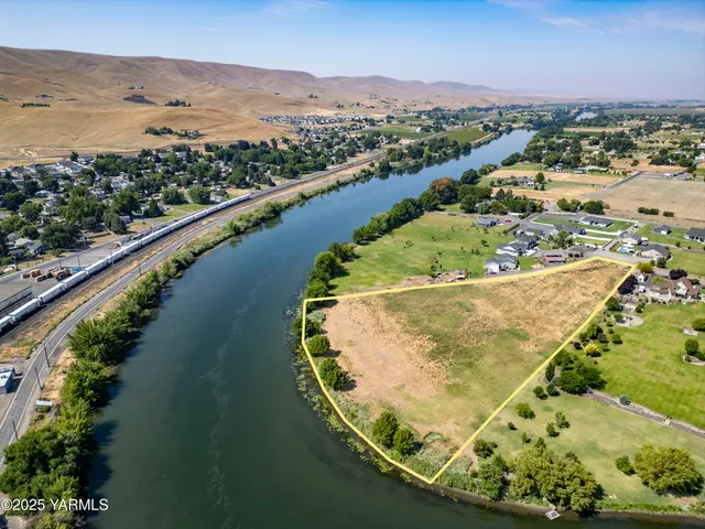an aerial view of a house with a lake view