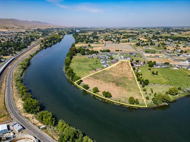an aerial view of a house with a lake view