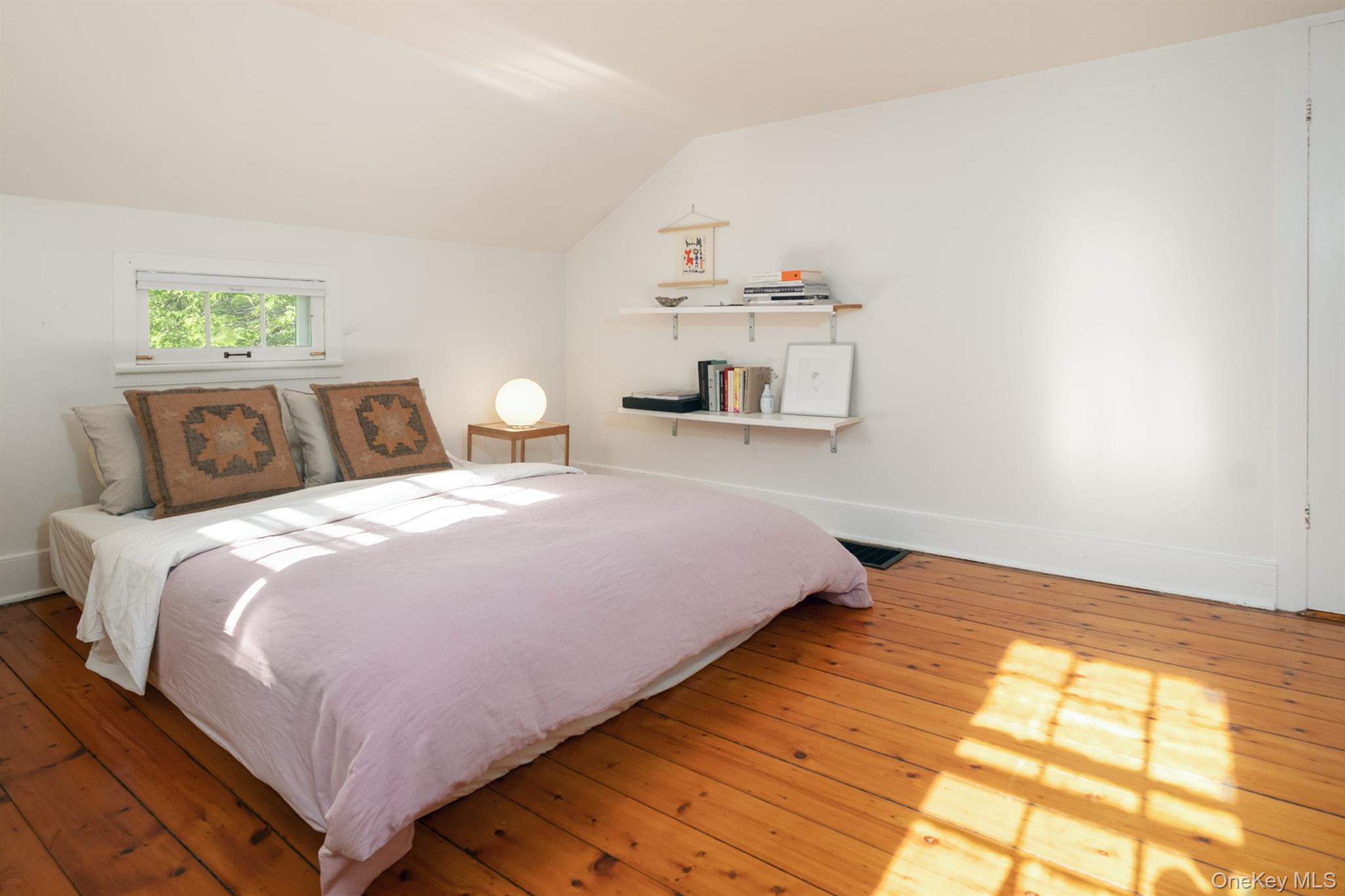 77 Upper Hook Road Rhinebeck, NY 12572 - Photo 25 of 48 a bed sitting in a bedroom next to a window