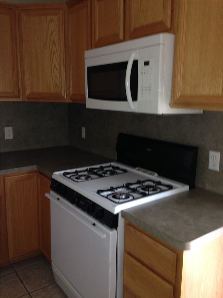 2429 Pintail Loop College Station, TX 77845 - Photo 4 of 20 a stove top oven sitting inside of a kitchen