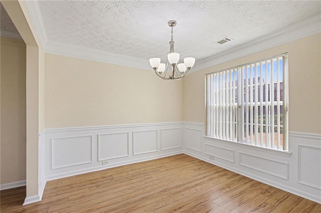 110 Pendergrass Farms Circle Pendergrass, GA 30567 - Photo 11 of 33 a view of an empty room with wooden floor and a window
