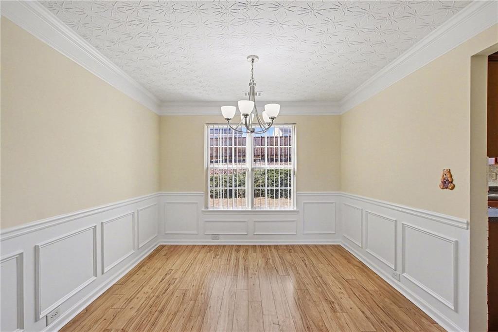 110 Pendergrass Farms Circle Pendergrass, GA 30567 - Photo 14 of 33 a view of an empty room with wooden floor and a window