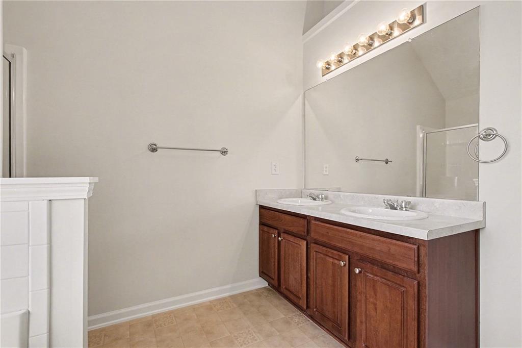 110 Pendergrass Farms Circle Pendergrass, GA 30567 - Photo 23 of 33 a bathroom with a sink and mirror
