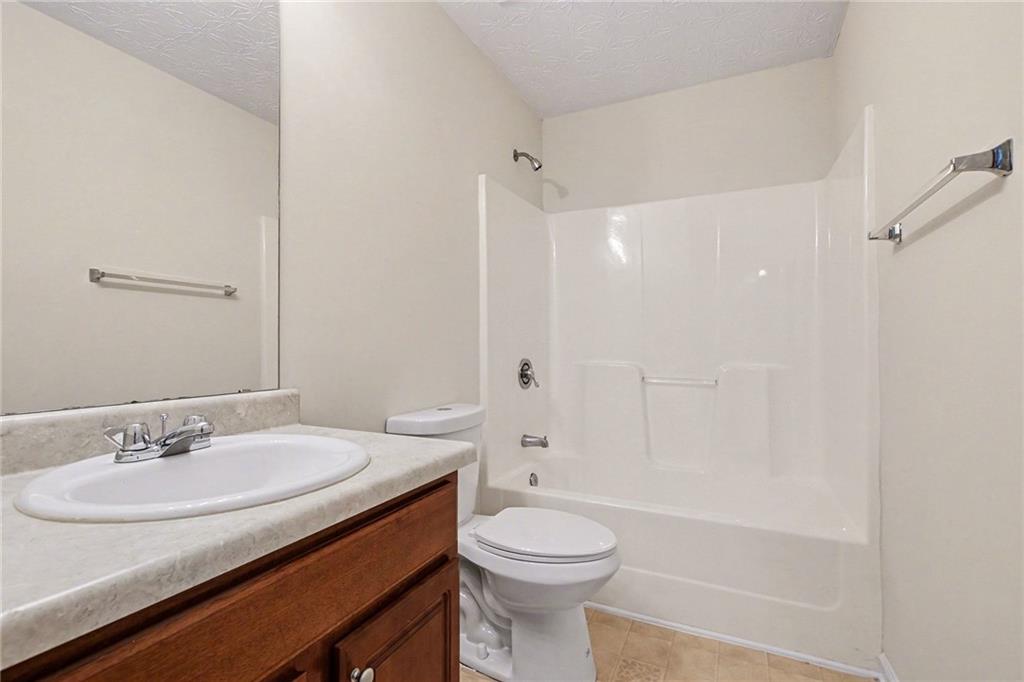 110 Pendergrass Farms Circle Pendergrass, GA 30567 - Photo 28 of 33 a bathroom with a sink a toilet and shower
