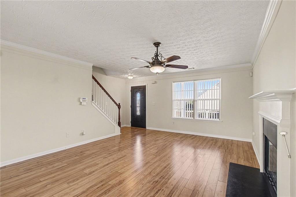 110 Pendergrass Farms Circle Pendergrass, GA 30567 - Photo 7 of 33 a view of an empty room with wooden floor and a window