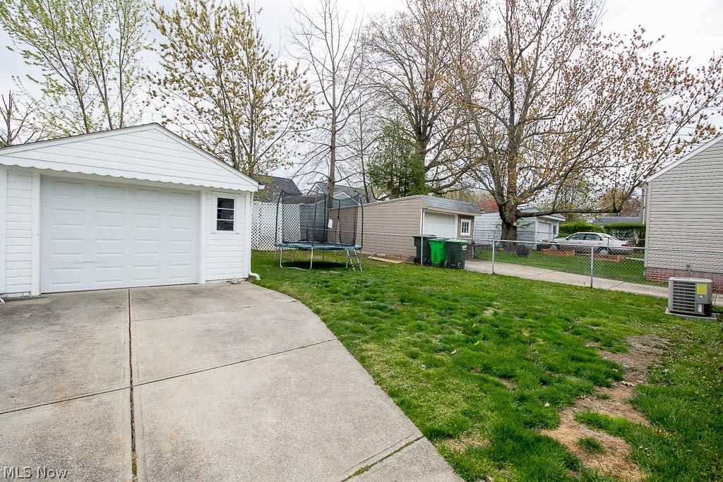 1661 Mapledale Road Wickliffe, OH 44092 - Photo 3 of 17 garage with fenced rear yard