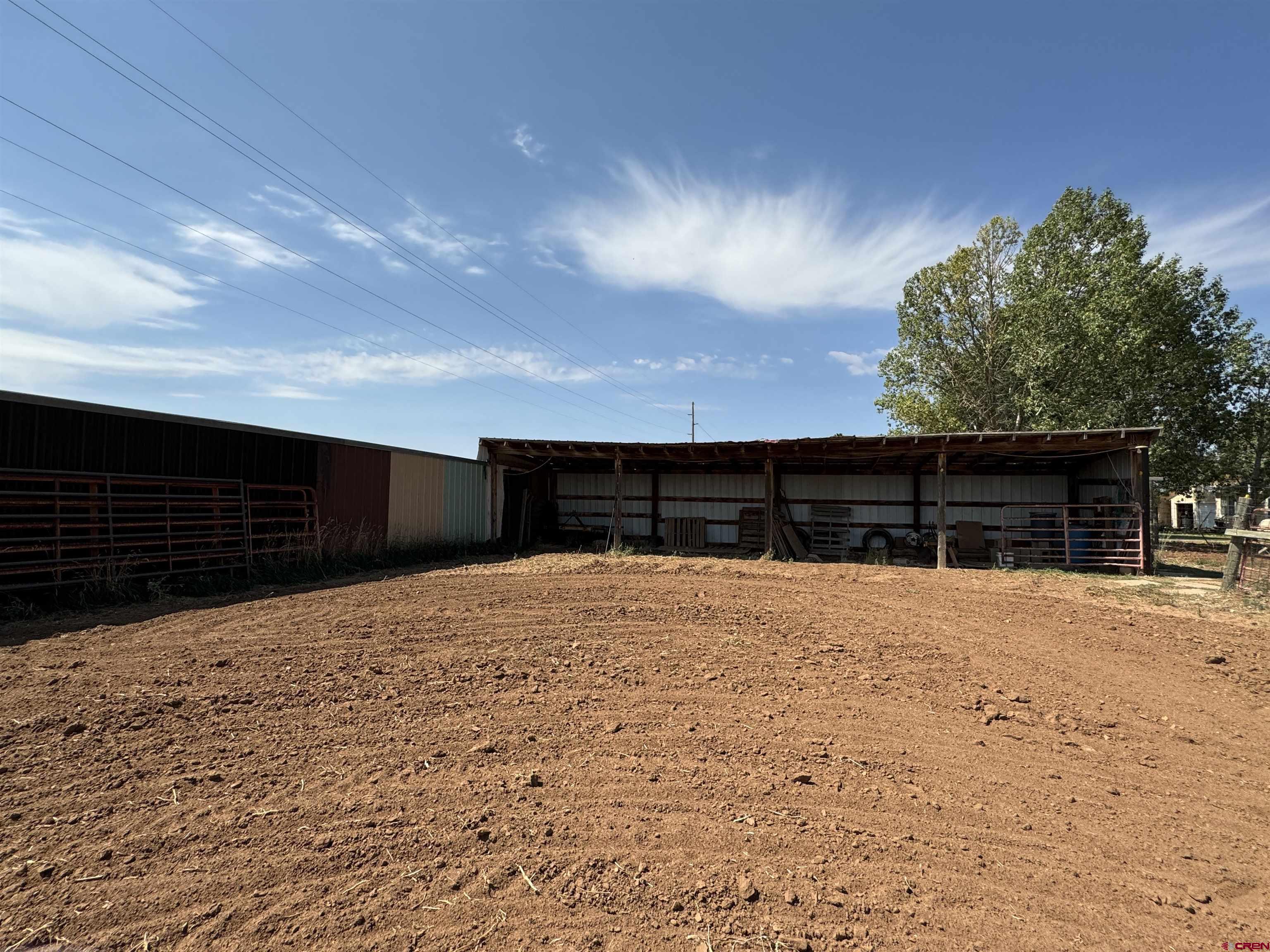 12383 Rd M Cahone, CO 81320 - Photo 16 of 42 a outside view of house with wooden fence