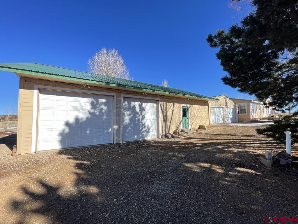 12383 Rd M Cahone, CO 81320 - Photo 2 of 42 a front view of a house with a yard