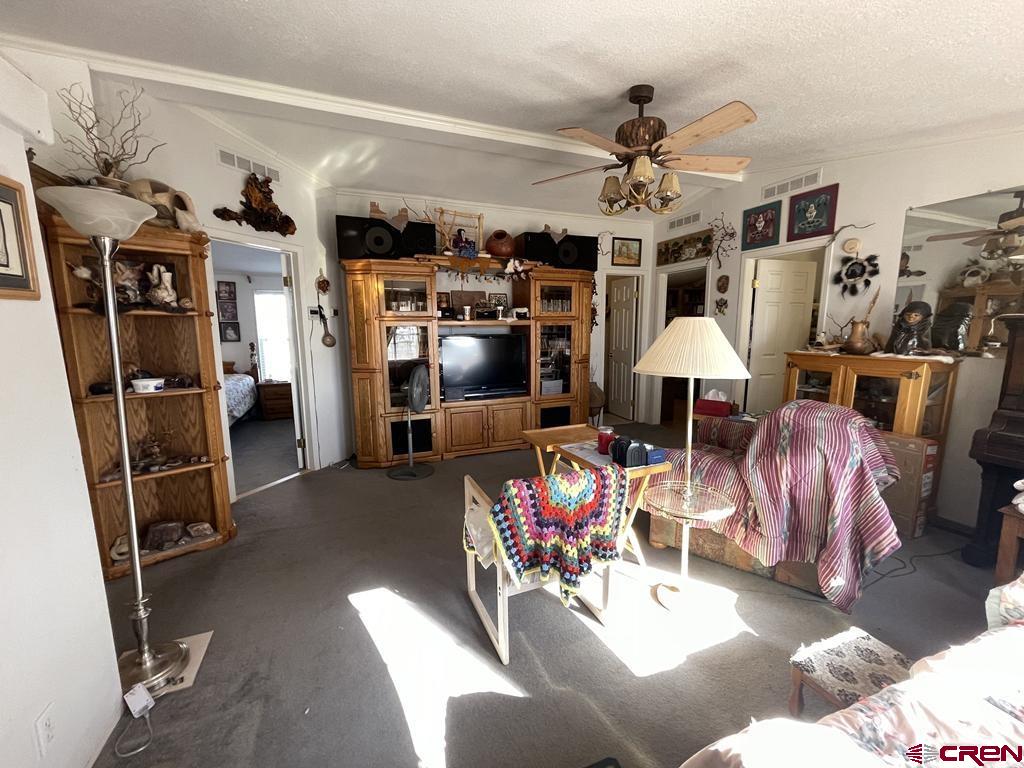 12383 Rd M Cahone, CO 81320 - Photo 21 of 42 a view of a livingroom with furniture and a flat screen tv