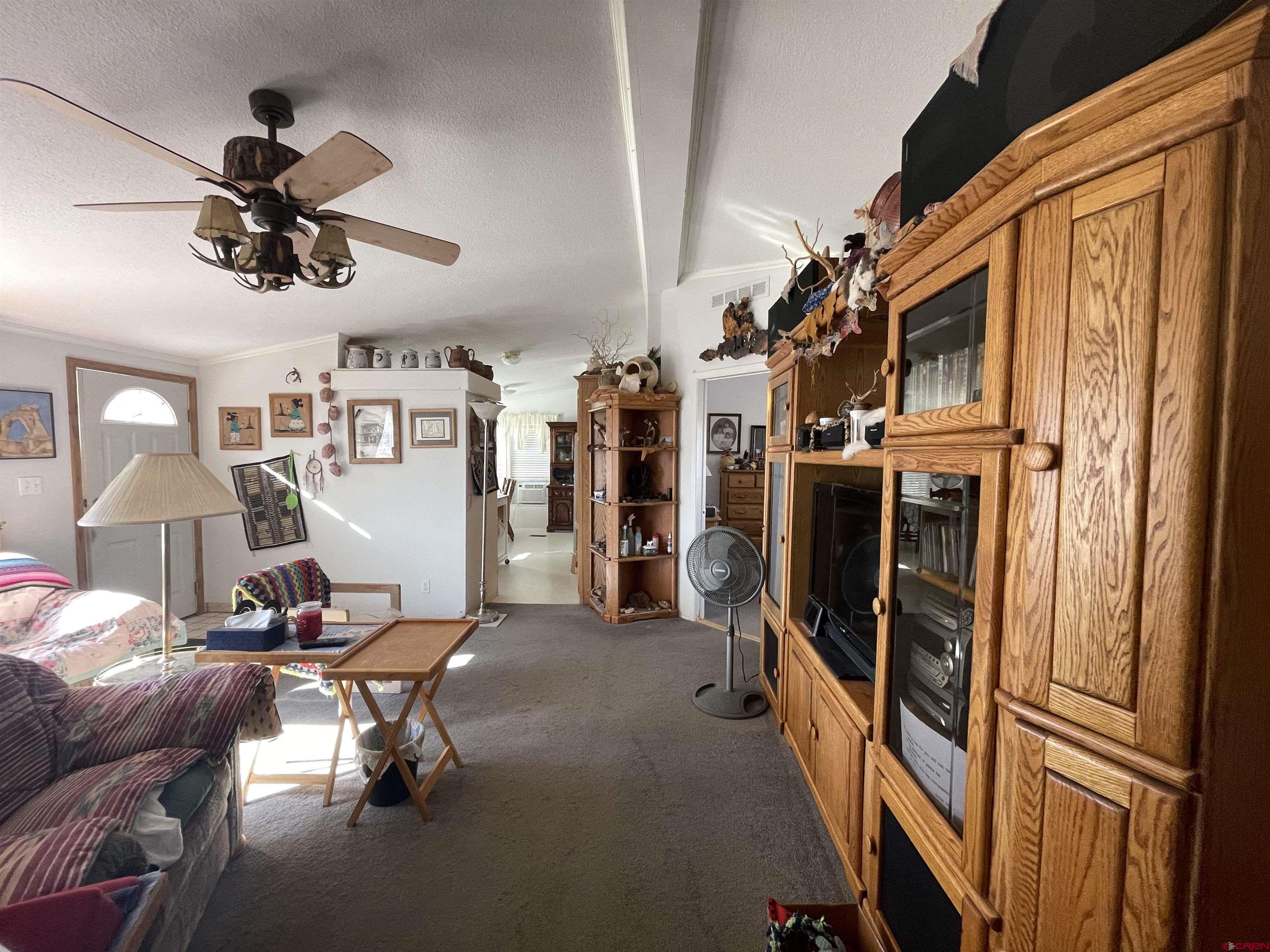 12383 Rd M Cahone, CO 81320 - Photo 22 of 42 a view of a livingroom with workspace and a window