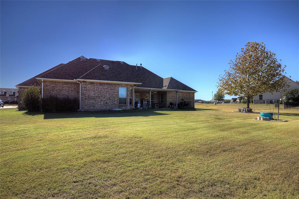 1066 Canyon Lake Road Wills Point, TX 75169 - Photo 31 of 40 a front view of a house with a garden