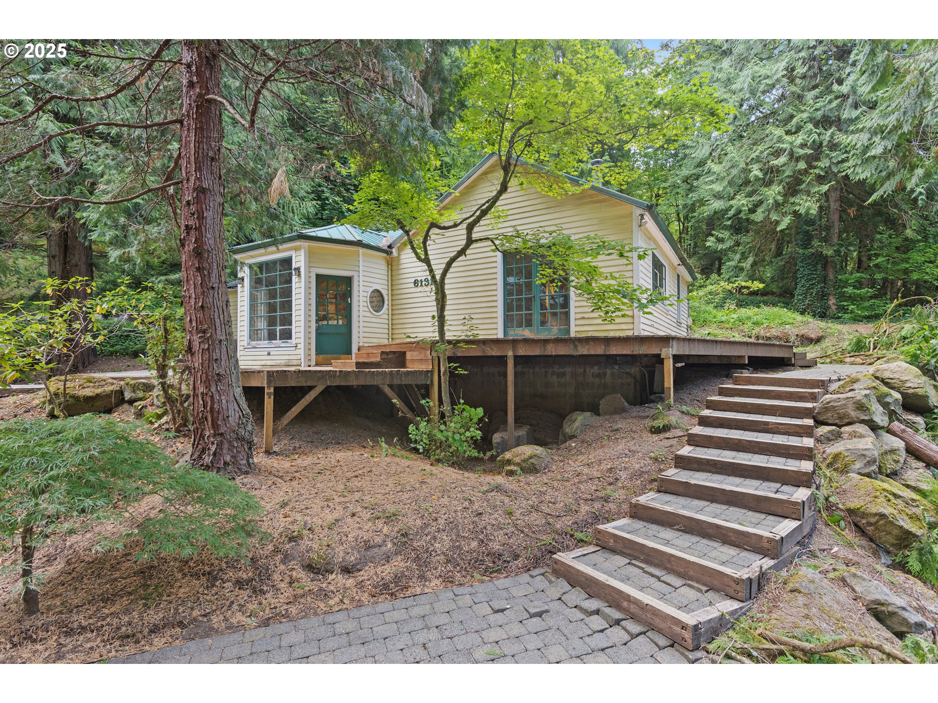 6131 Northwest Thompson Road Portland, OR 97210 - Photo 1 of 48 a backyard of a house with barbeque oven