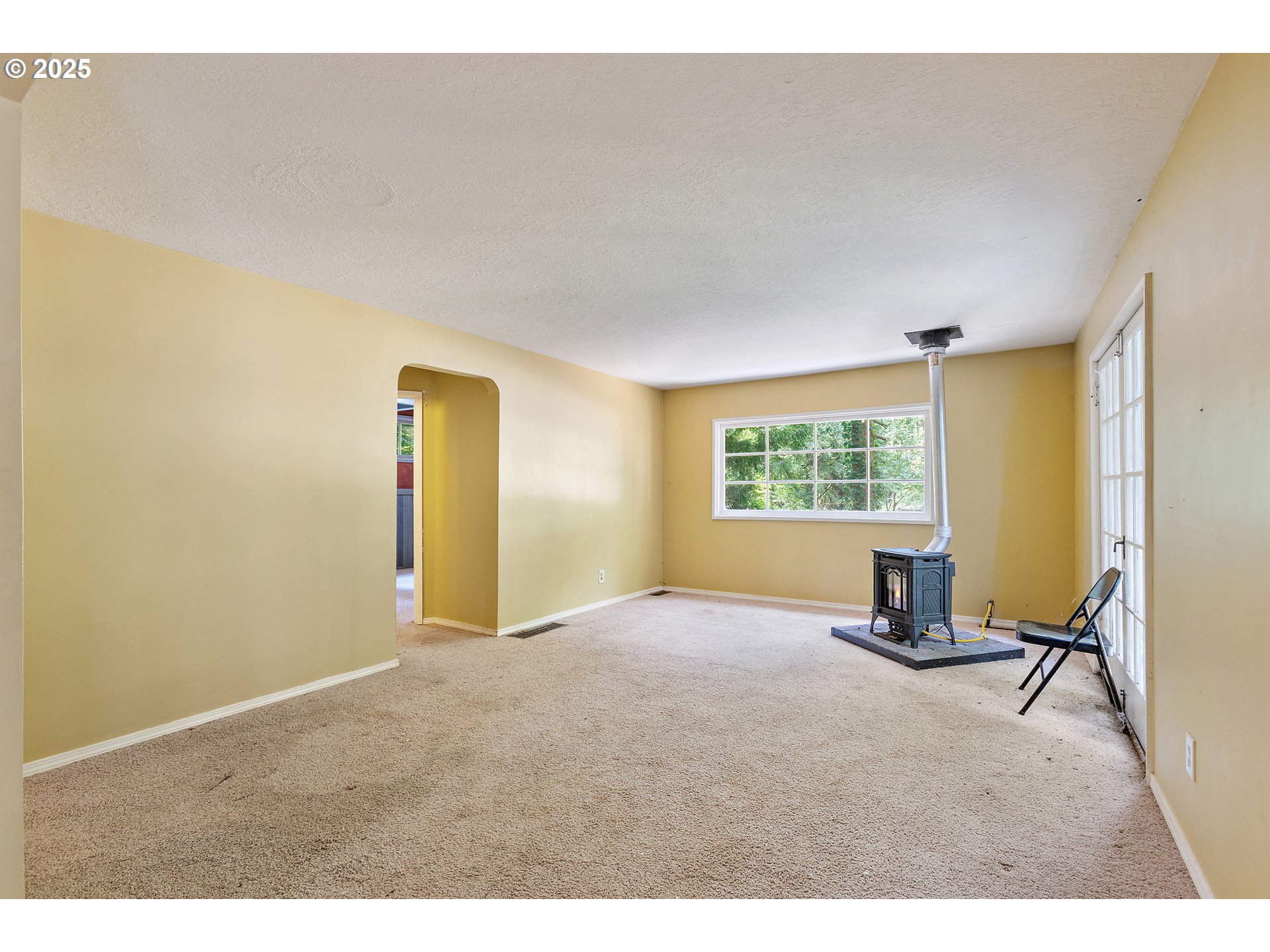 6131 Northwest Thompson Road Portland, OR 97210 - Photo 15 of 48 a view of an empty room with a window