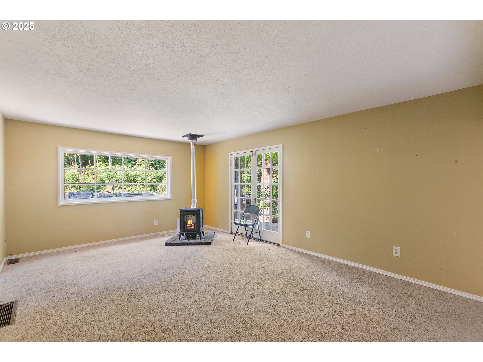 6131 Northwest Thompson Road Portland, OR 97210 - Photo 16 of 48 a room with a window and a ceiling fan