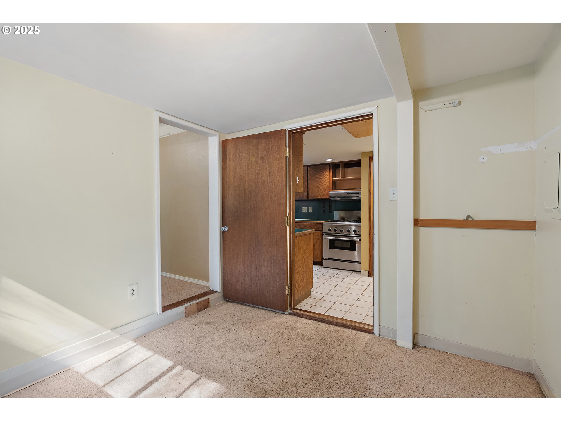 6131 Northwest Thompson Road Portland, OR 97210 - Photo 23 of 48 a view interior of a house and an empty room