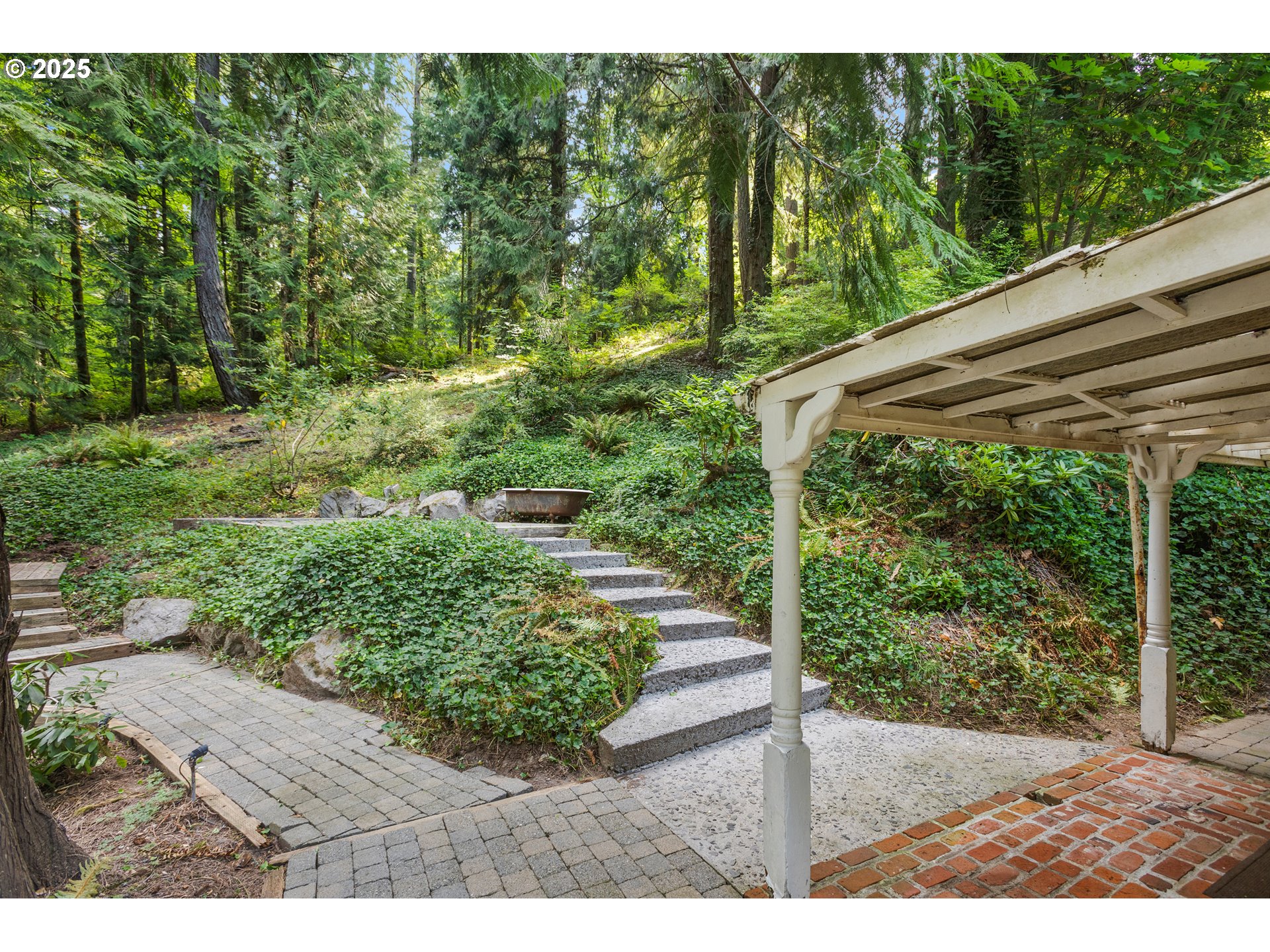 6131 Northwest Thompson Road Portland, OR 97210 - Photo 24 of 48 a view of a backyard with pathway