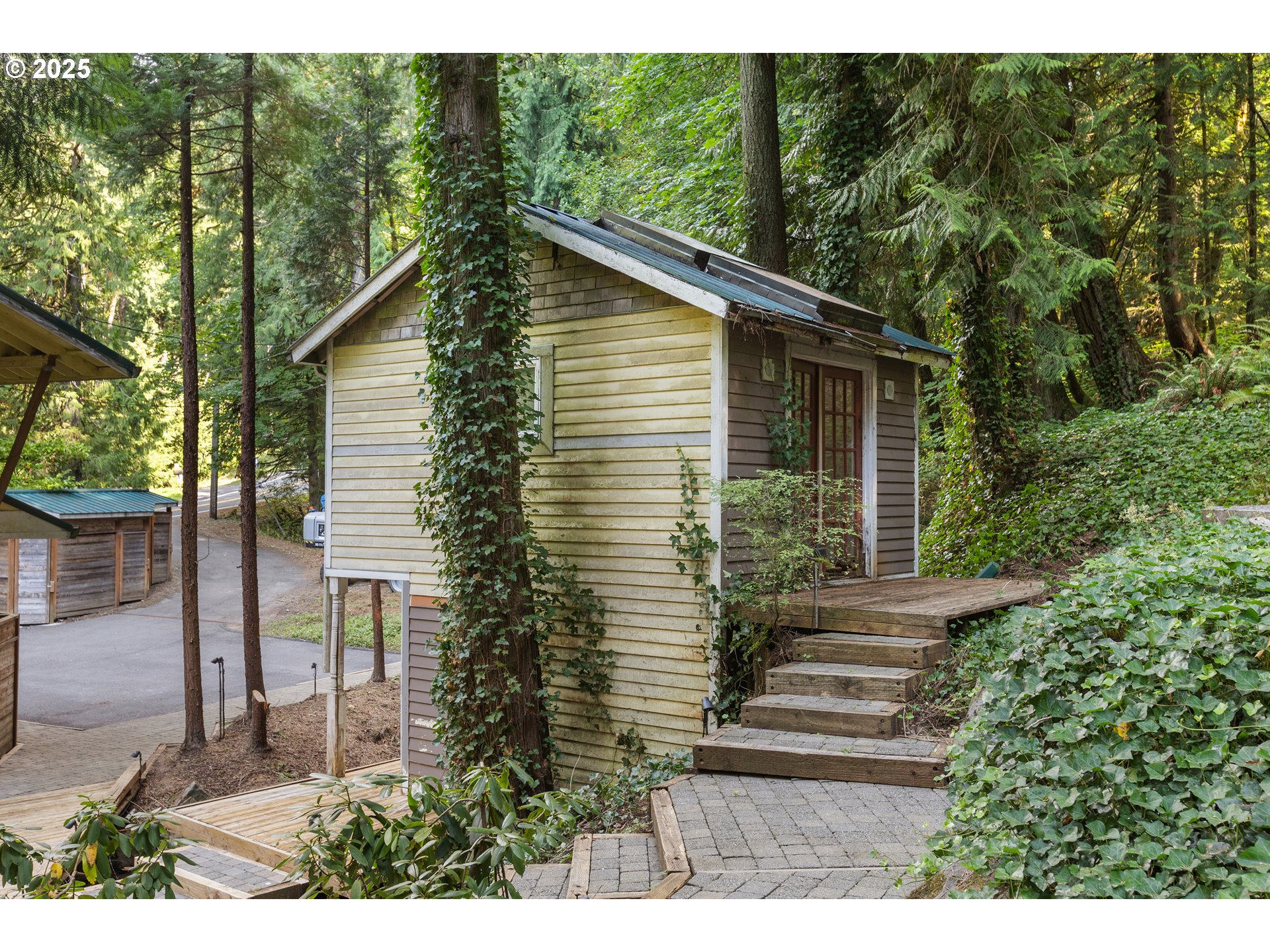 6131 Northwest Thompson Road Portland, OR 97210 - Photo 25 of 48 a view of a house with a yard
