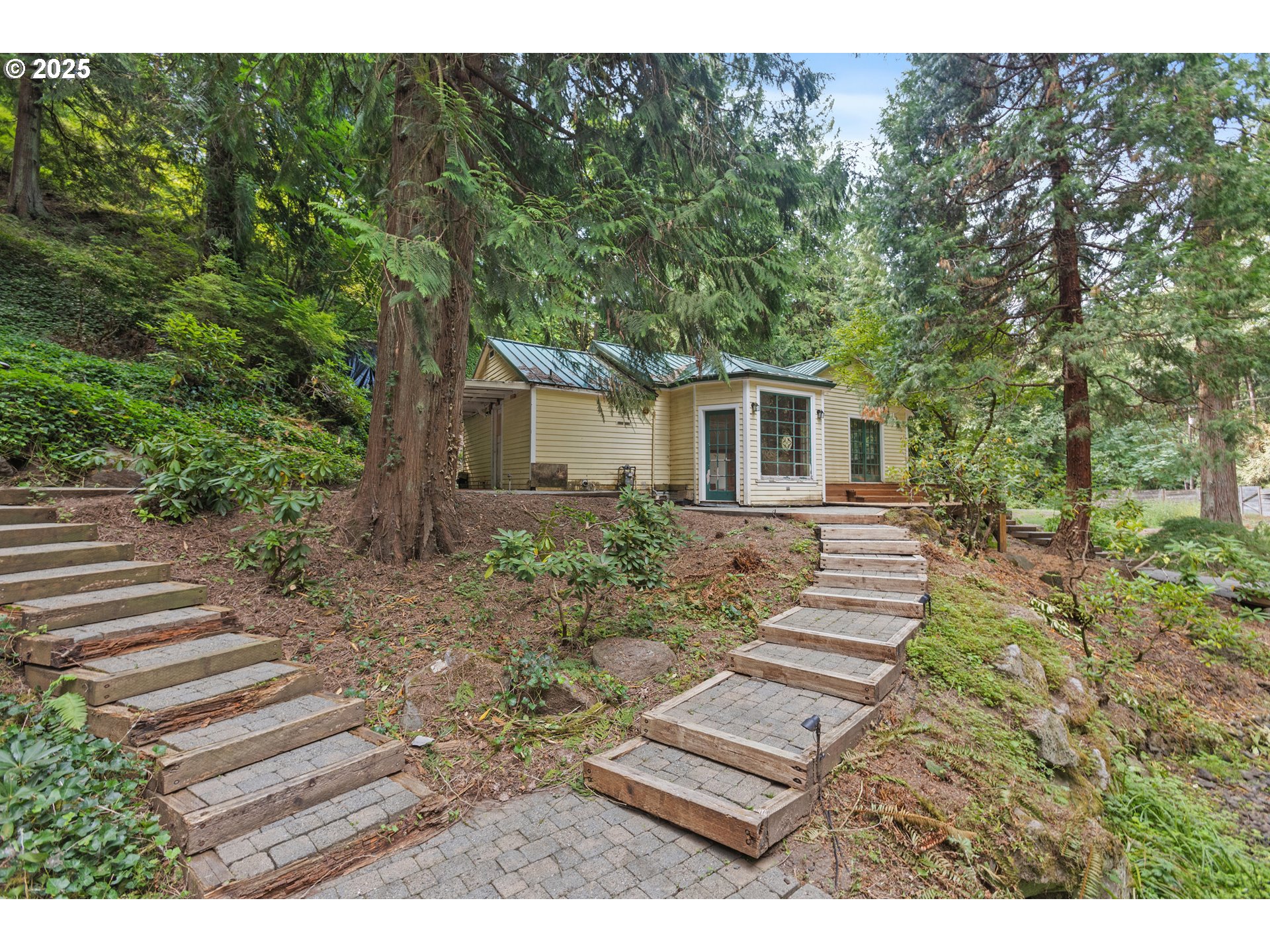 6131 Northwest Thompson Road Portland, OR 97210 - Photo 3 of 48 a view of a yard in front of house