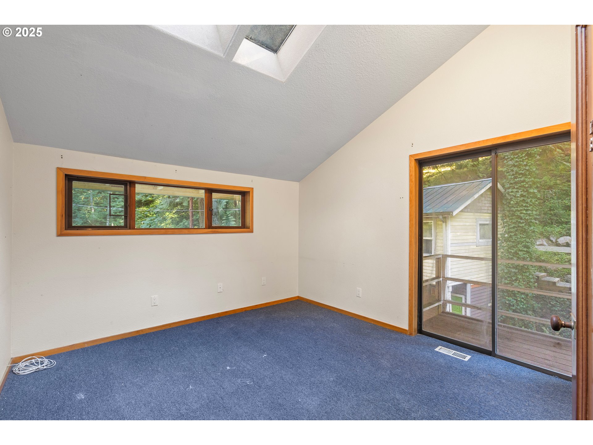 6131 Northwest Thompson Road Portland, OR 97210 - Photo 37 of 48 a view of an empty room with a window