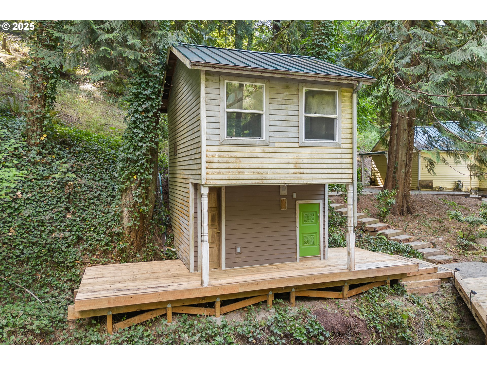 6131 Northwest Thompson Road Portland, OR 97210 - Photo 41 of 48 a side view of a house with a yard