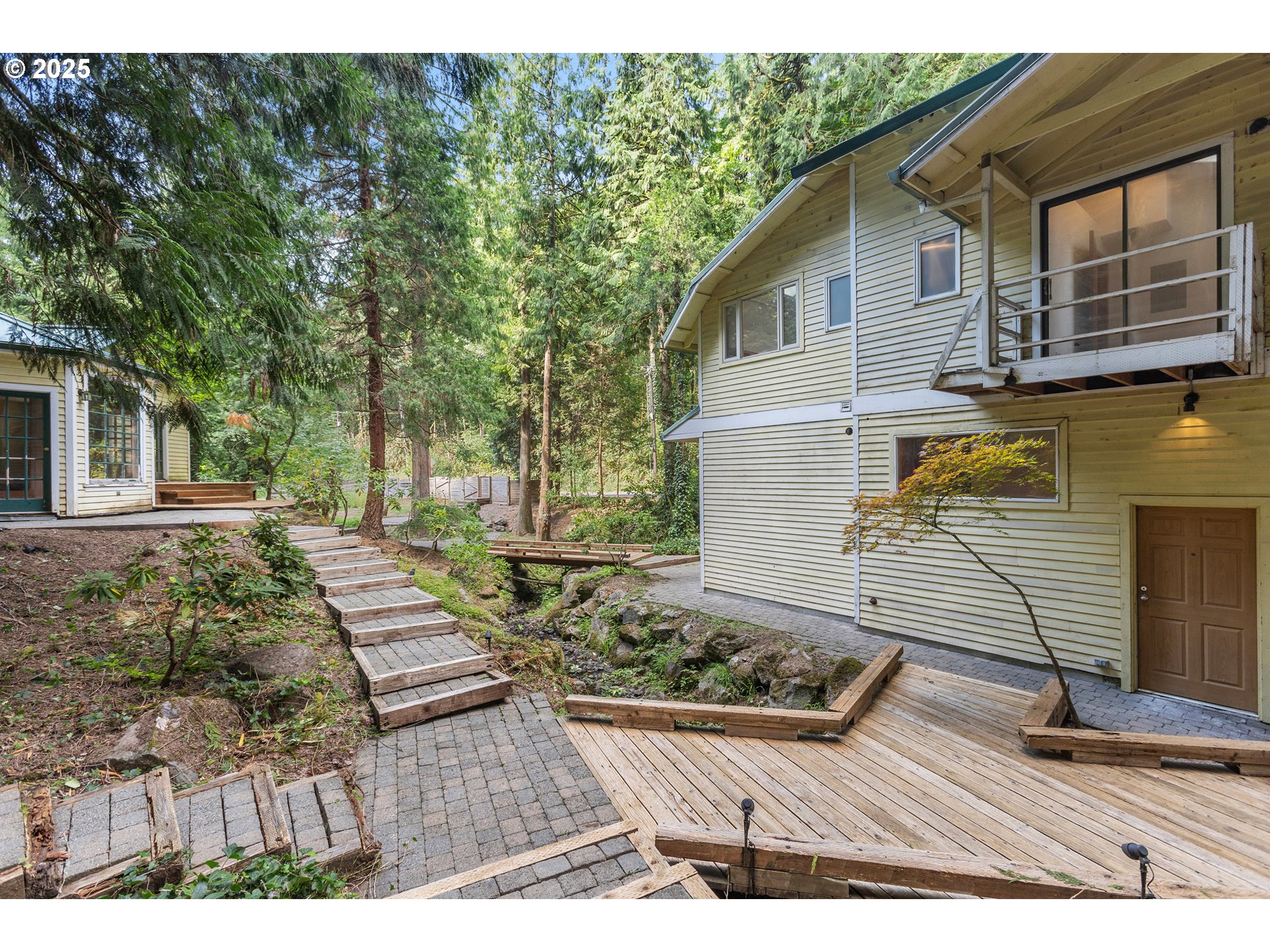 6131 Northwest Thompson Road Portland, OR 97210 - Photo 42 of 48 a view of a house with backyard and sitting area
