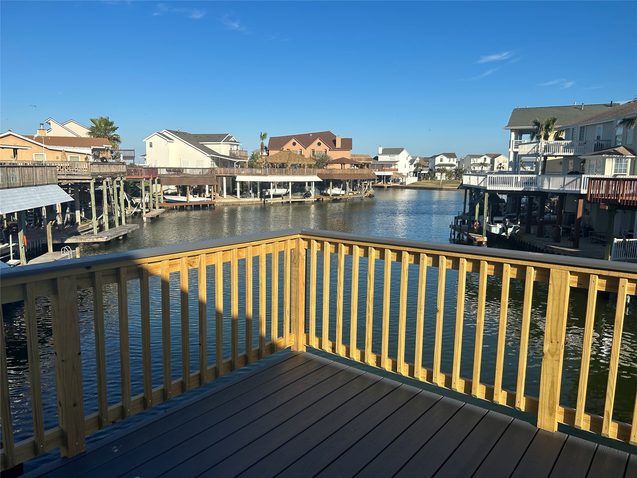 306 Isles End Road Tiki Island, TX 77554 - Photo 1 of 25 a view of swimming pool from a balcony