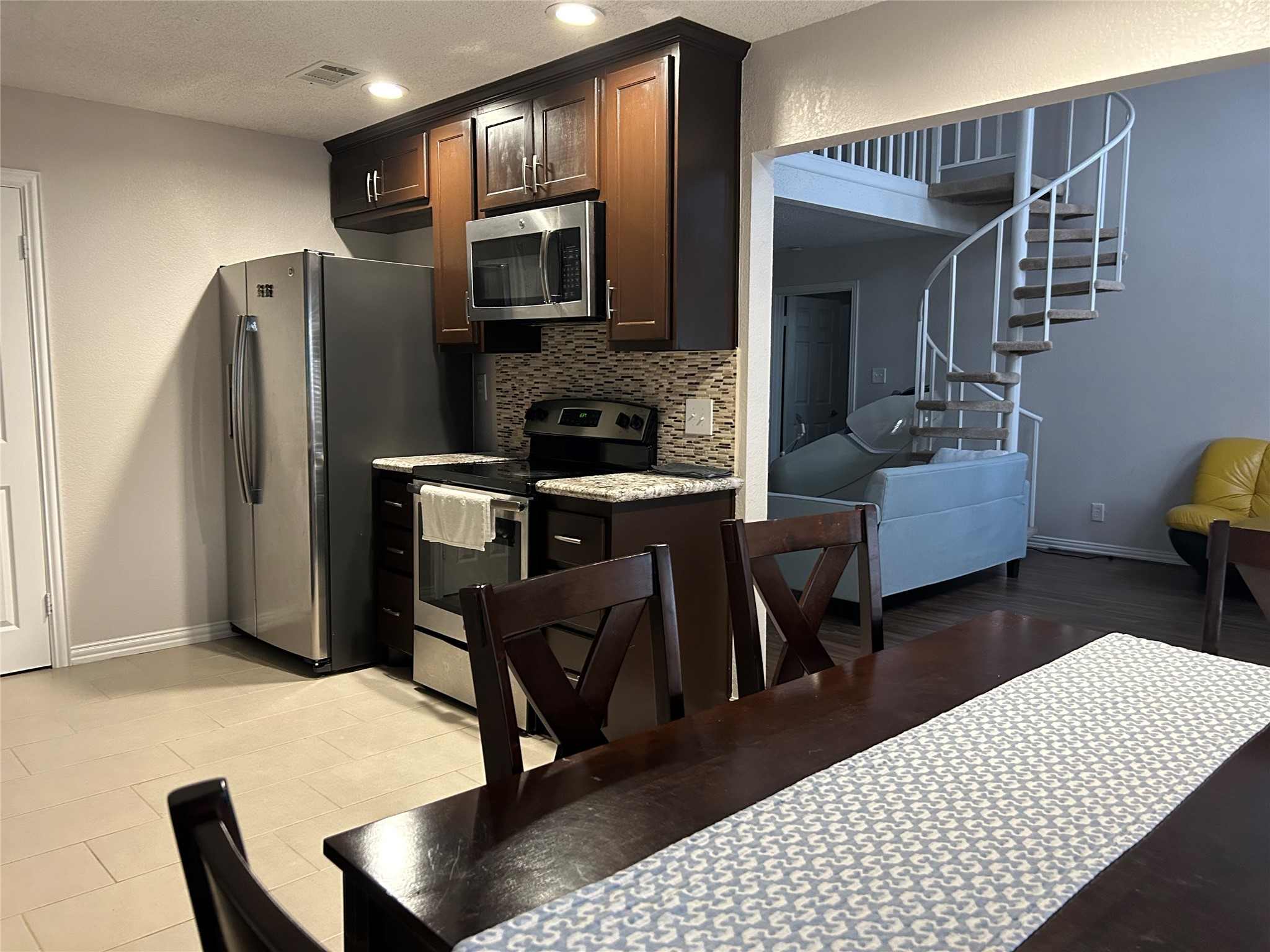 306 Isles End Road Tiki Island, TX 77554 - Photo 12 of 25 a living room with furniture and a flat screen tv