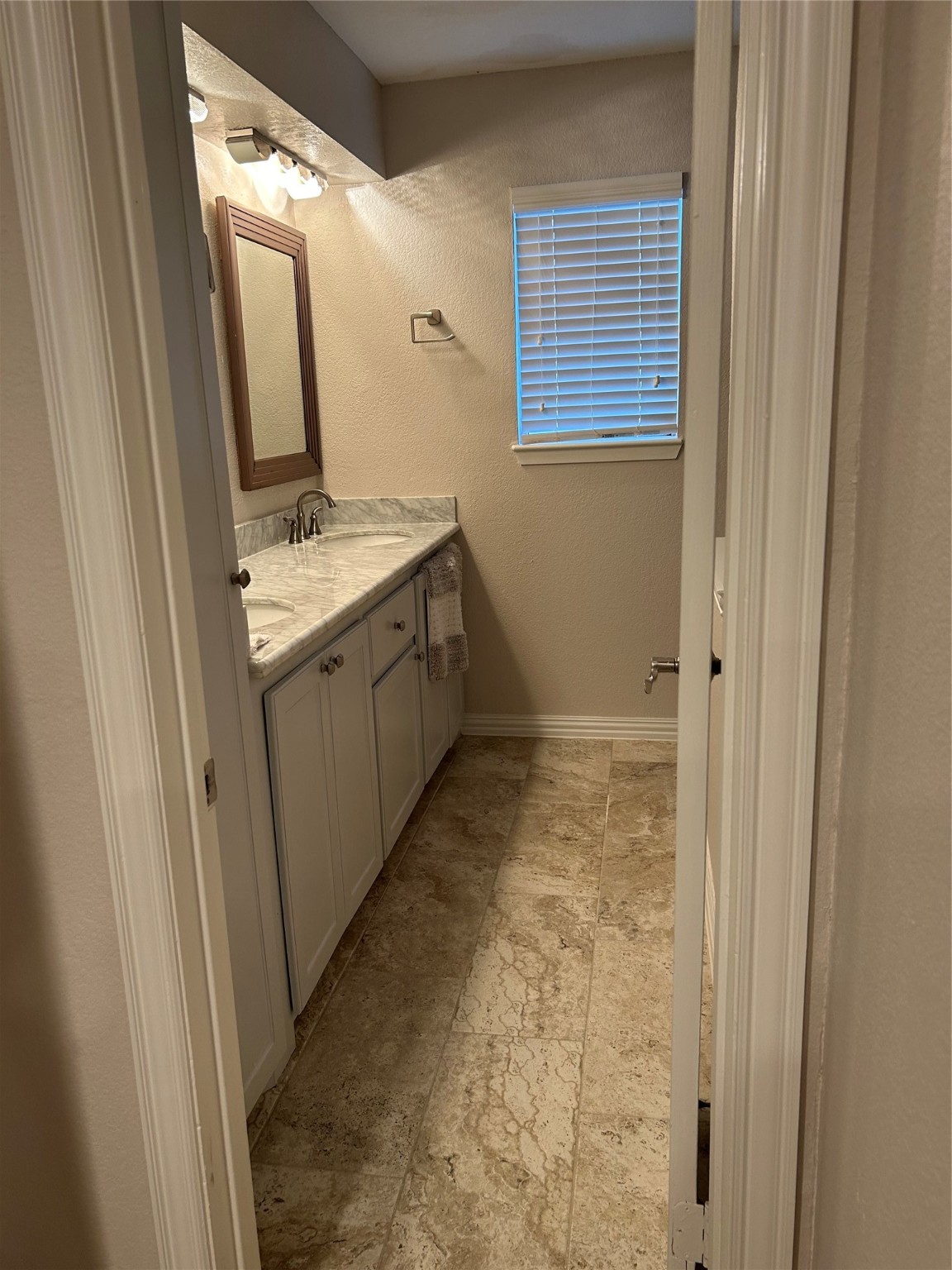 306 Isles End Road Tiki Island, TX 77554 - Photo 15 of 25 a bathroom with a sink and mirror with bathtub